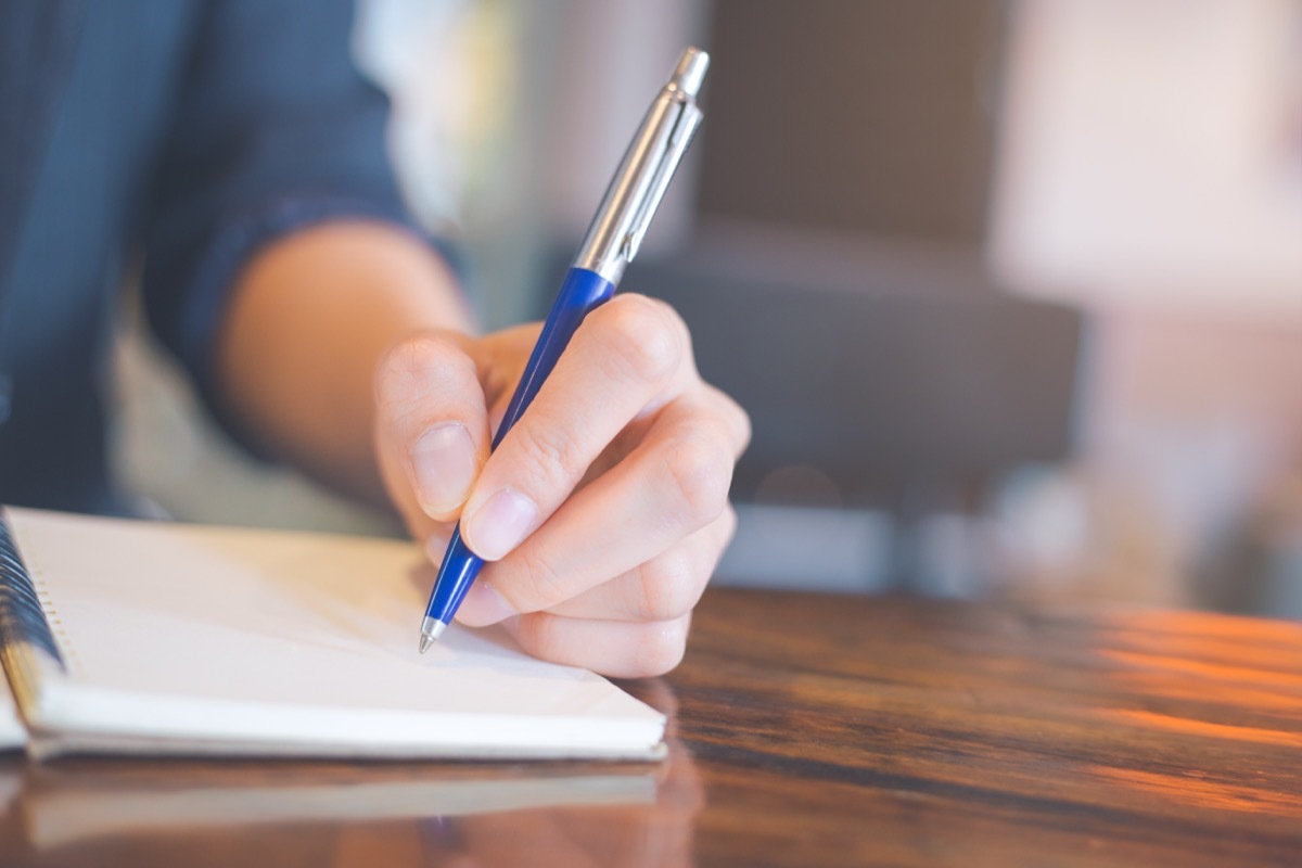 Woman writing in a notebook