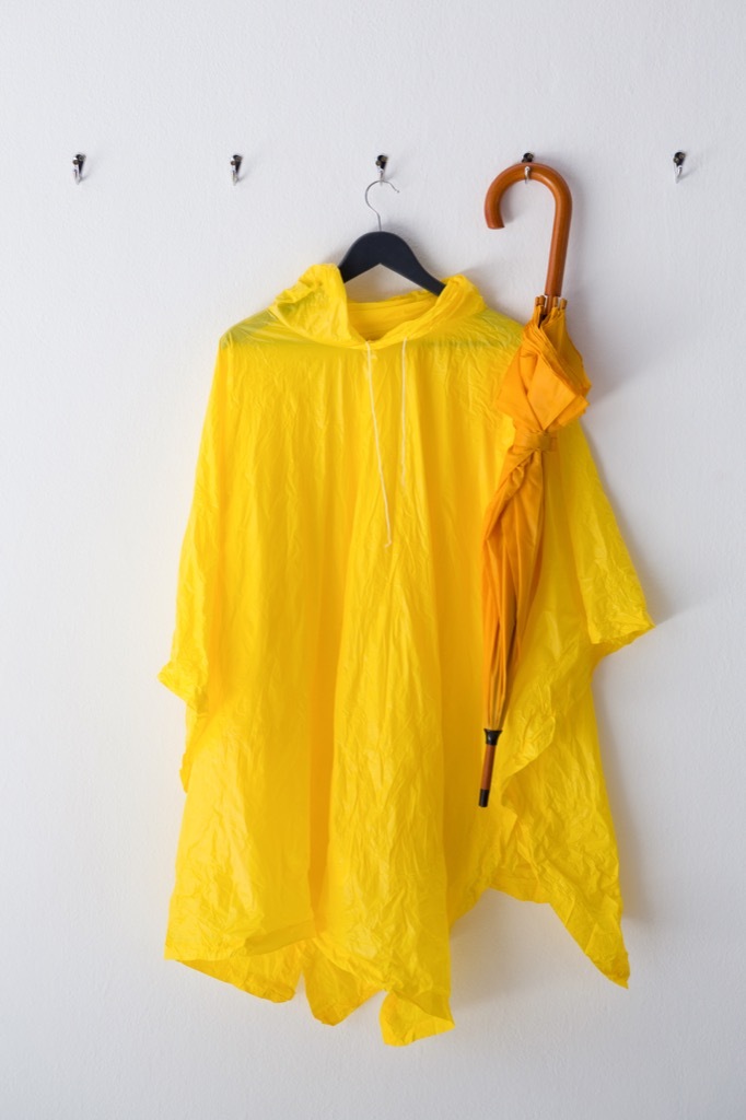 Raincoat and umbrella hanging on the wall