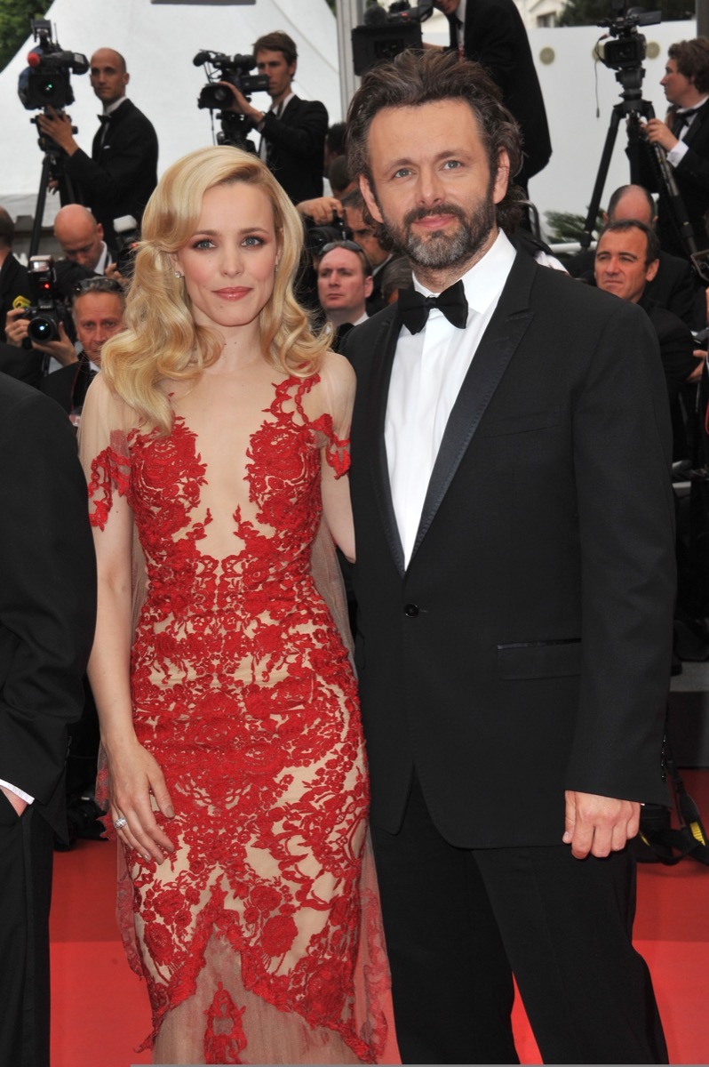 Rachel McAdams wears a red dress and Michael Sheen wears a black suit at the premiere of 