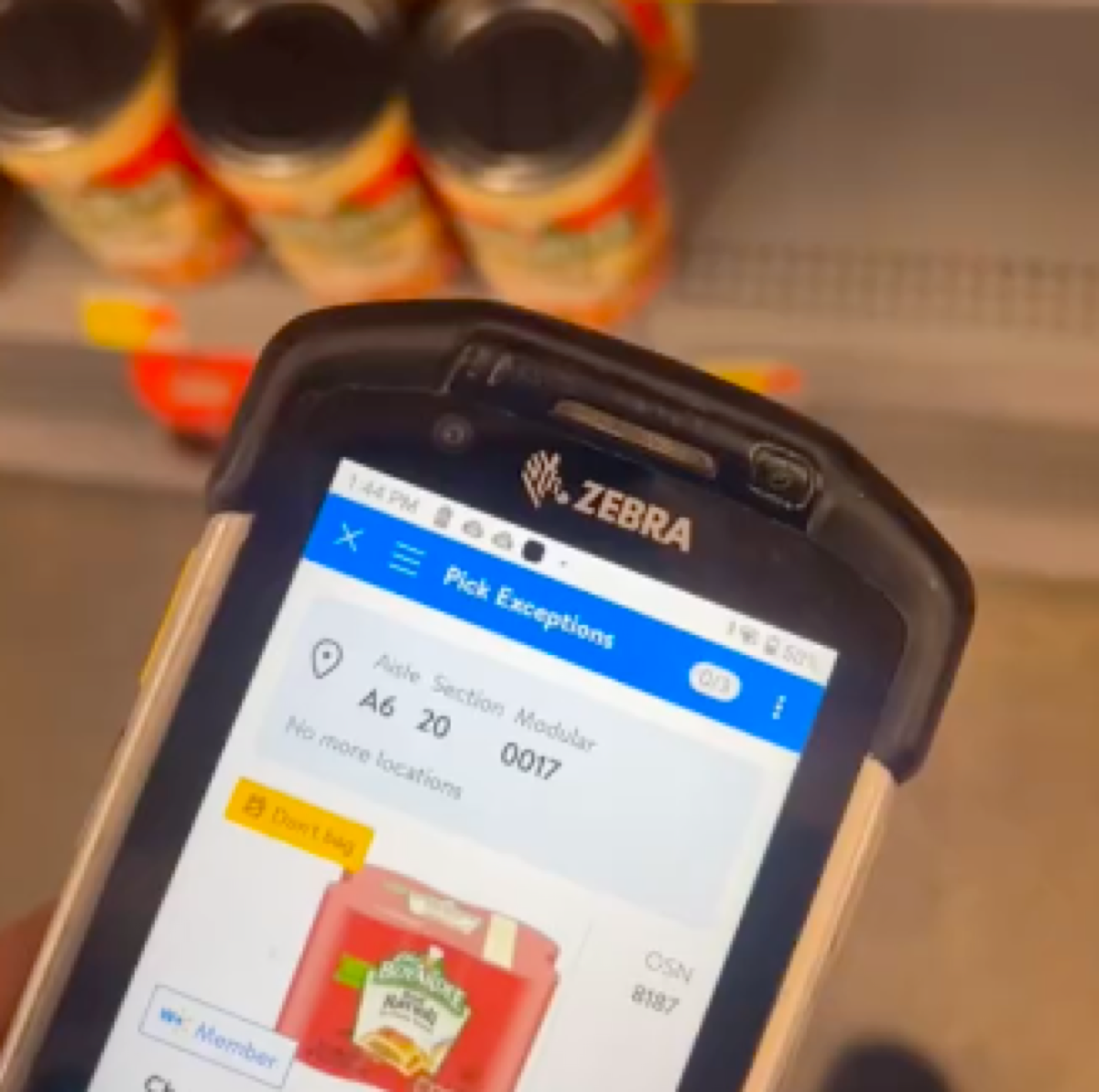 TikTok still of Walmart worker showing out of stock items on the shelves of the store