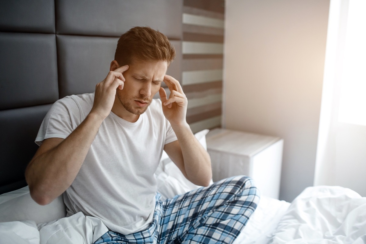 Man Holding His Head Due to Pain