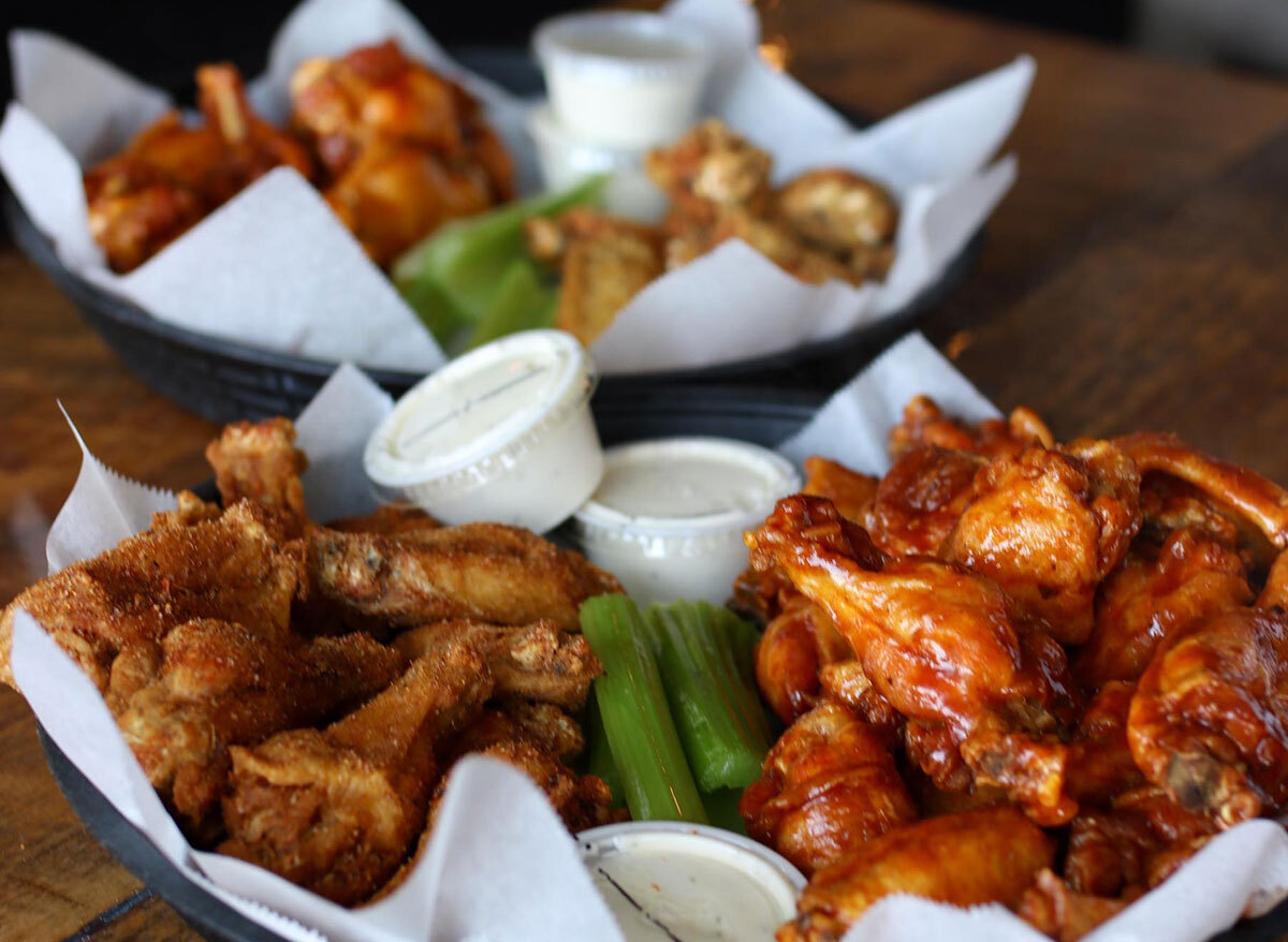 platters of chicken wings with ranch and celery