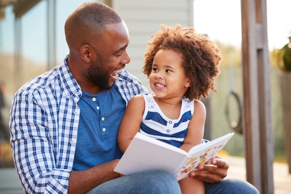 dad reading a book to his young daughter, dad jokes