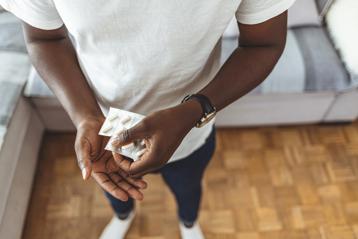 Man taking supplements