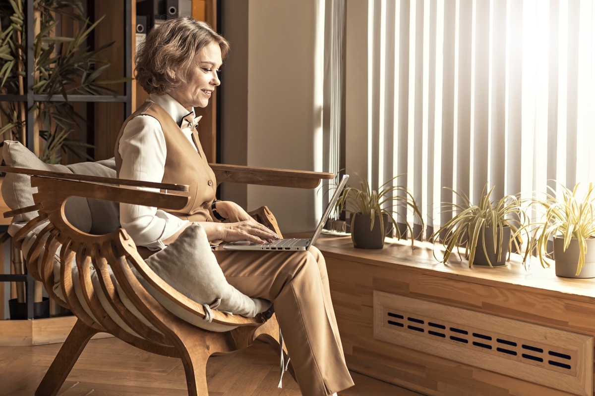 older business woman in trouser suit