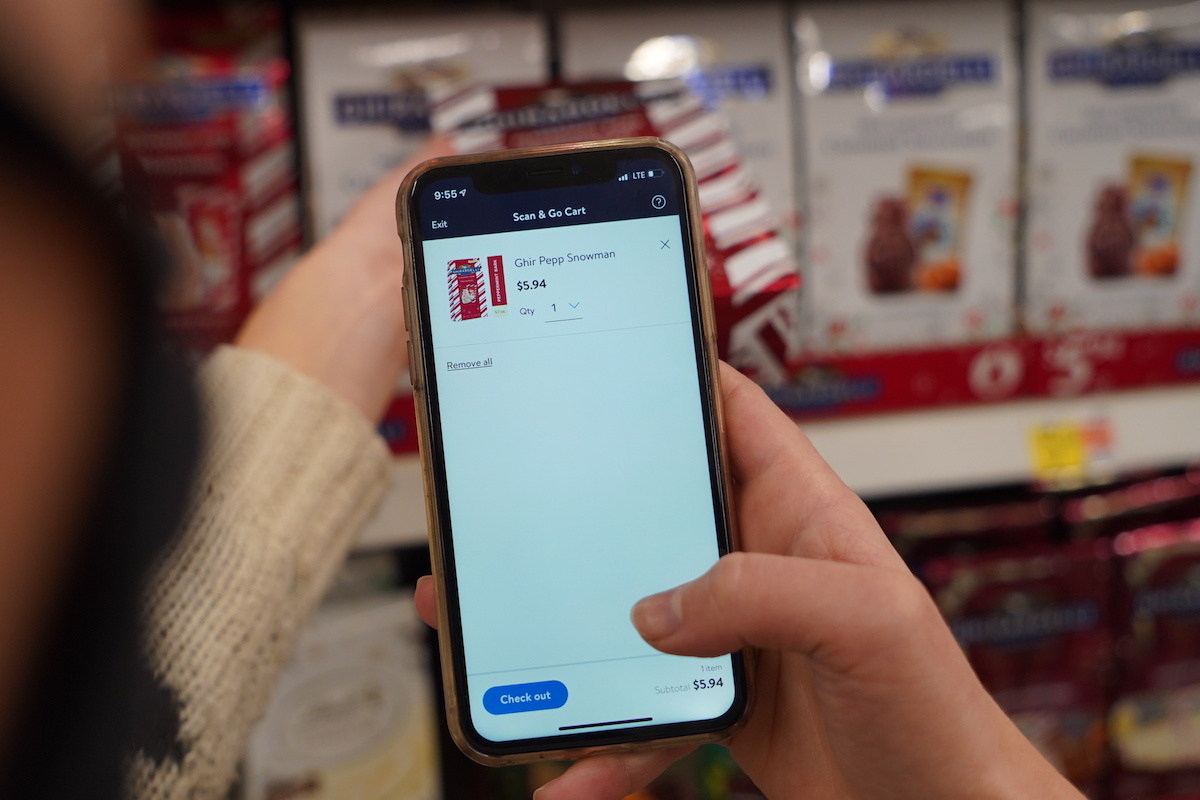 Customer Using Walmart+ Scan & Go