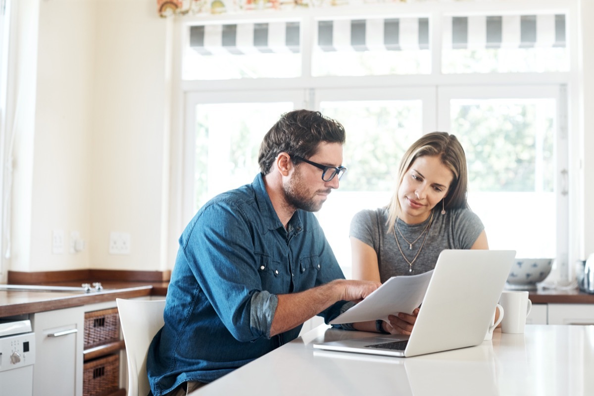 Shot of a young couple working on their finances together at home