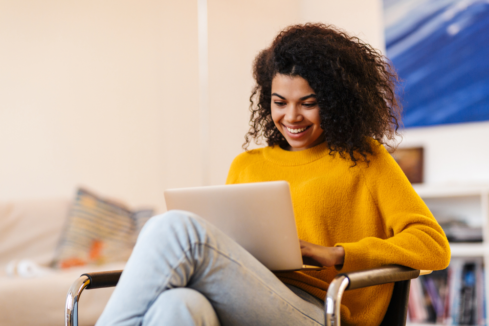 woman using a laptop in her office