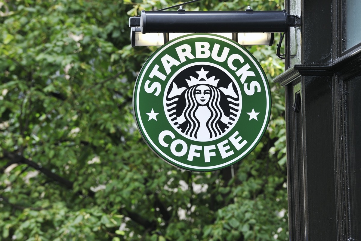 Edinburgh, Scotland - July 19, 2011: A Starbucks Coffee sign outside a Starbucks Coffee outlet on Edinburgh's Royal Mile. Starbucks Corporation is an international coffee and coffeehouse chain based in Seattle, Washington.