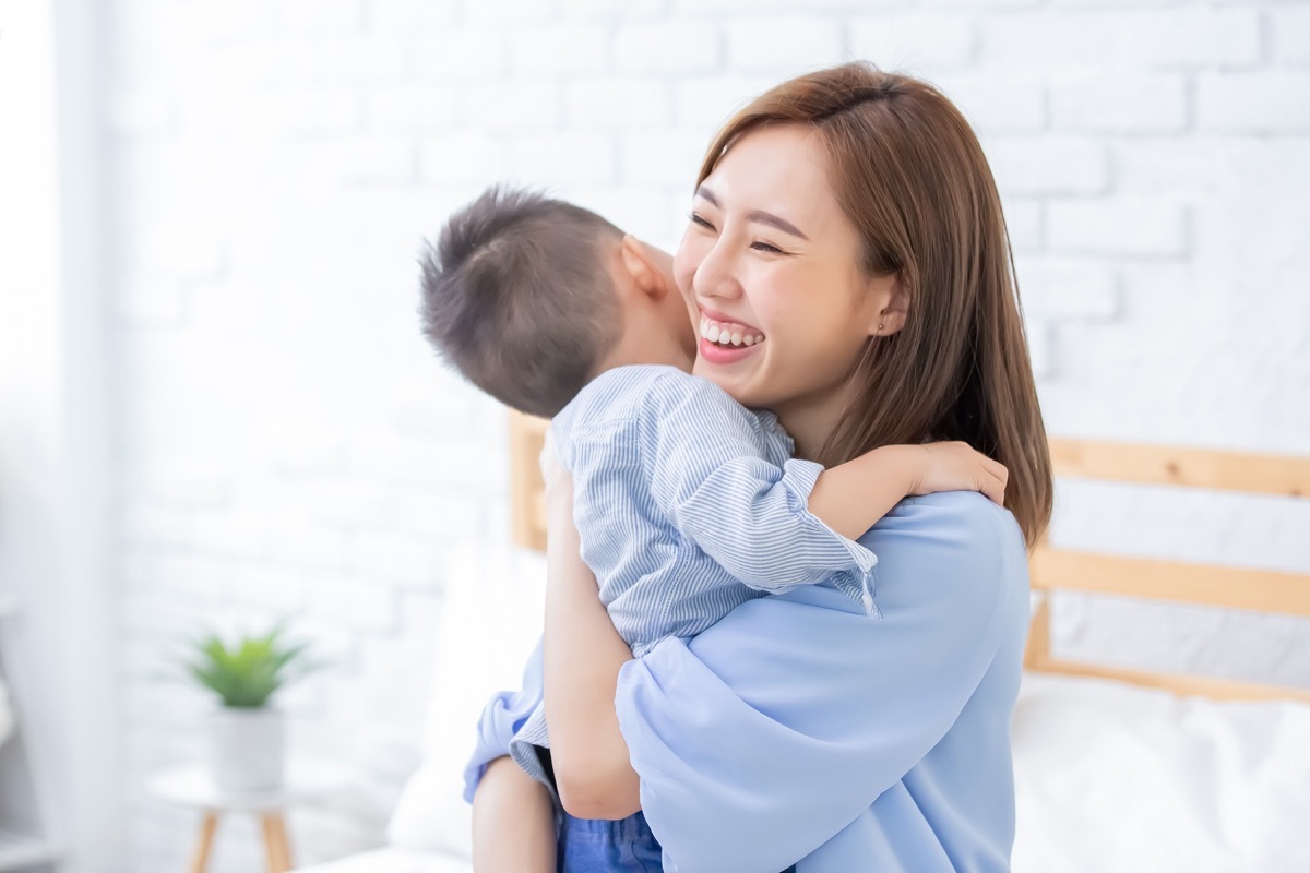 young woman holding her child