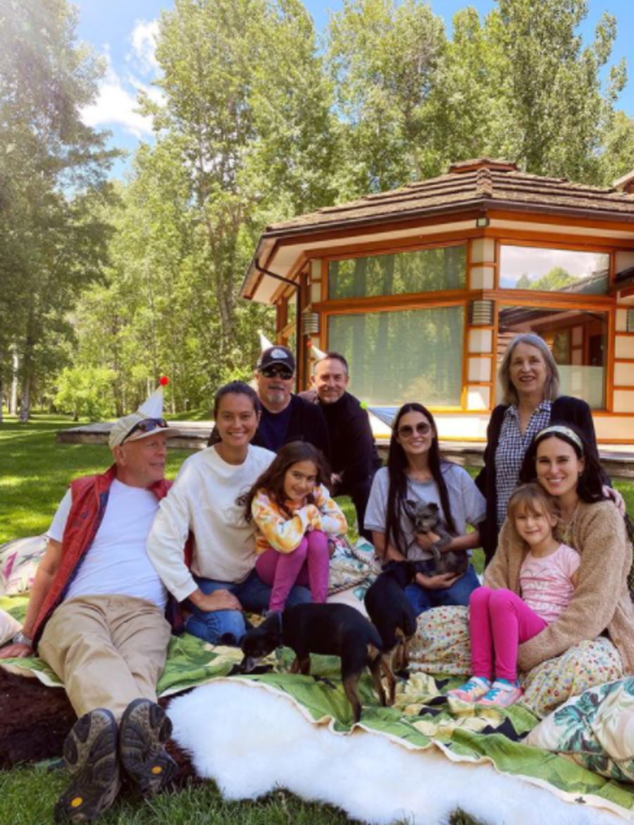 Emma Heming Willis, Bruce Willis, Demi Moore, and other family members posing for a photo outside