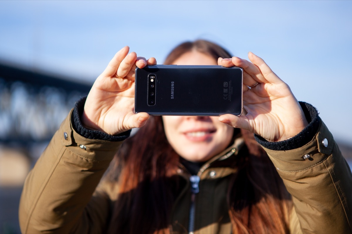 Kiev, Ukraine - March 01, 2019: Brand new Samsung Galaxy S10. Girl taking photo.