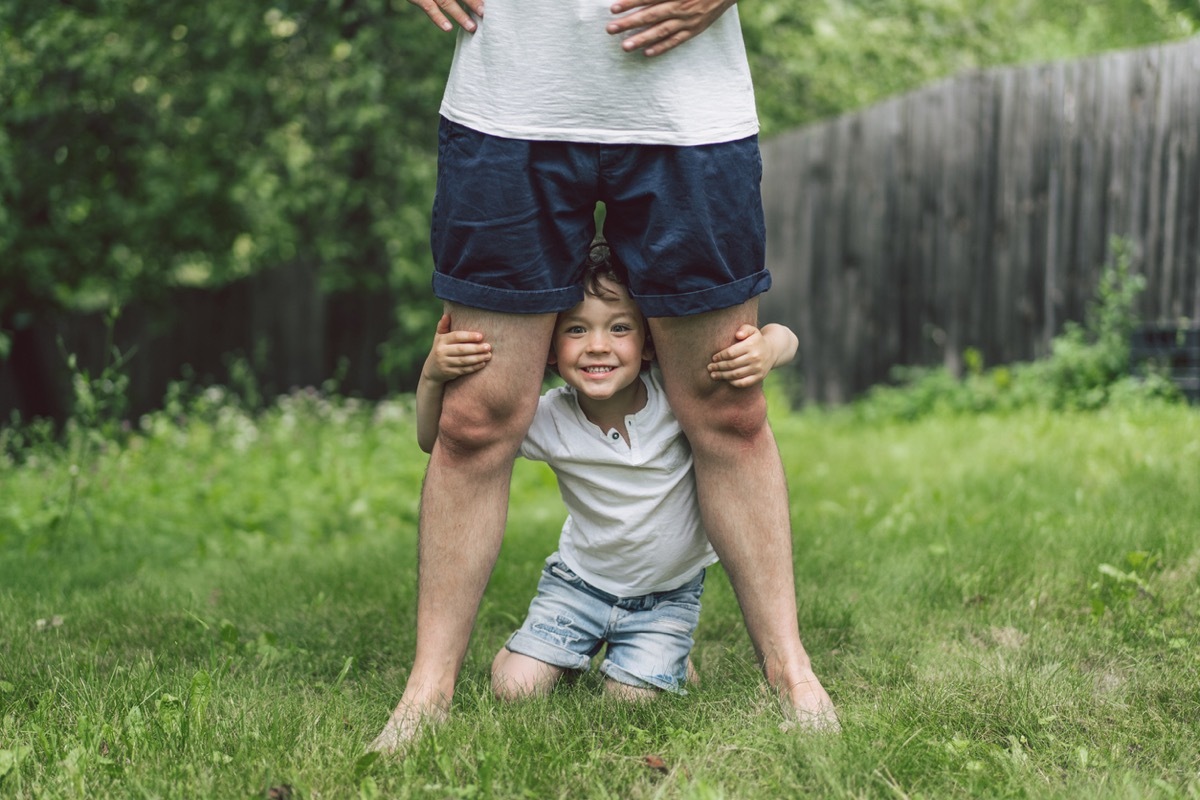 father and son playing outdoors