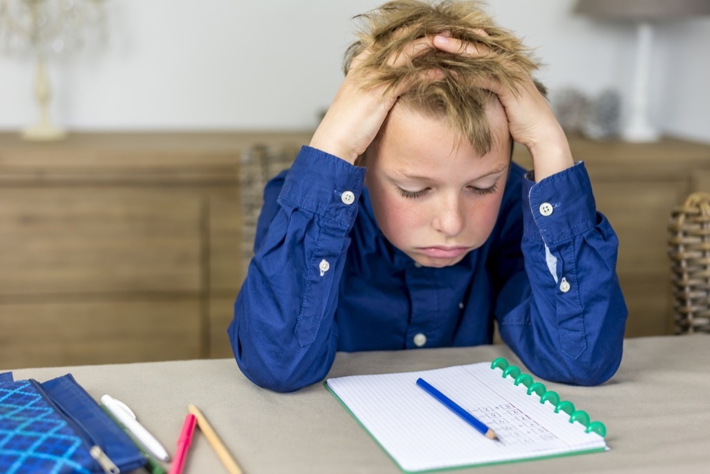 boy doing homework, things you should never say to a teacher