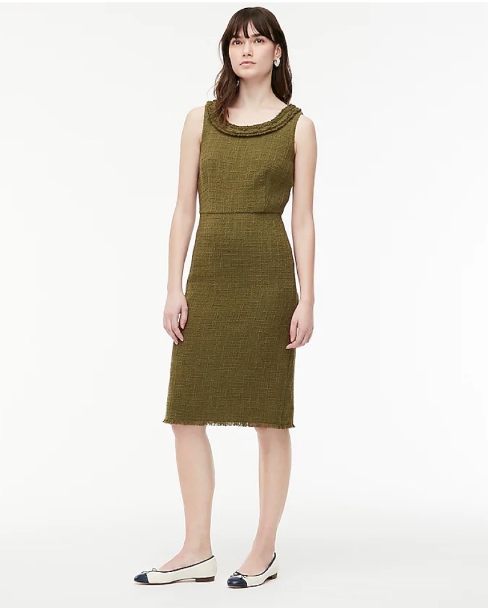 young white woman in green sheath dress