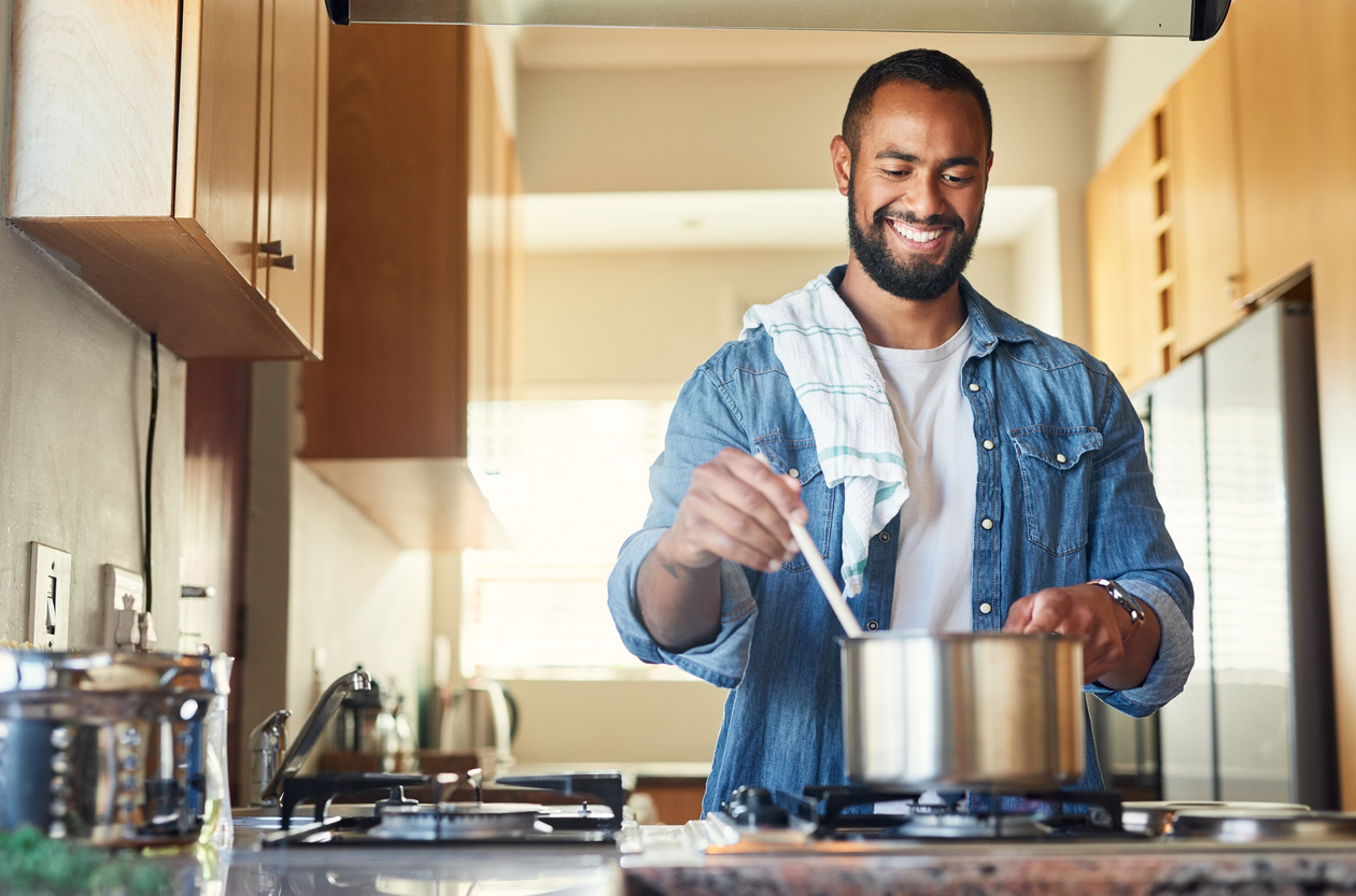 man cooking healthy meals to fight cancer