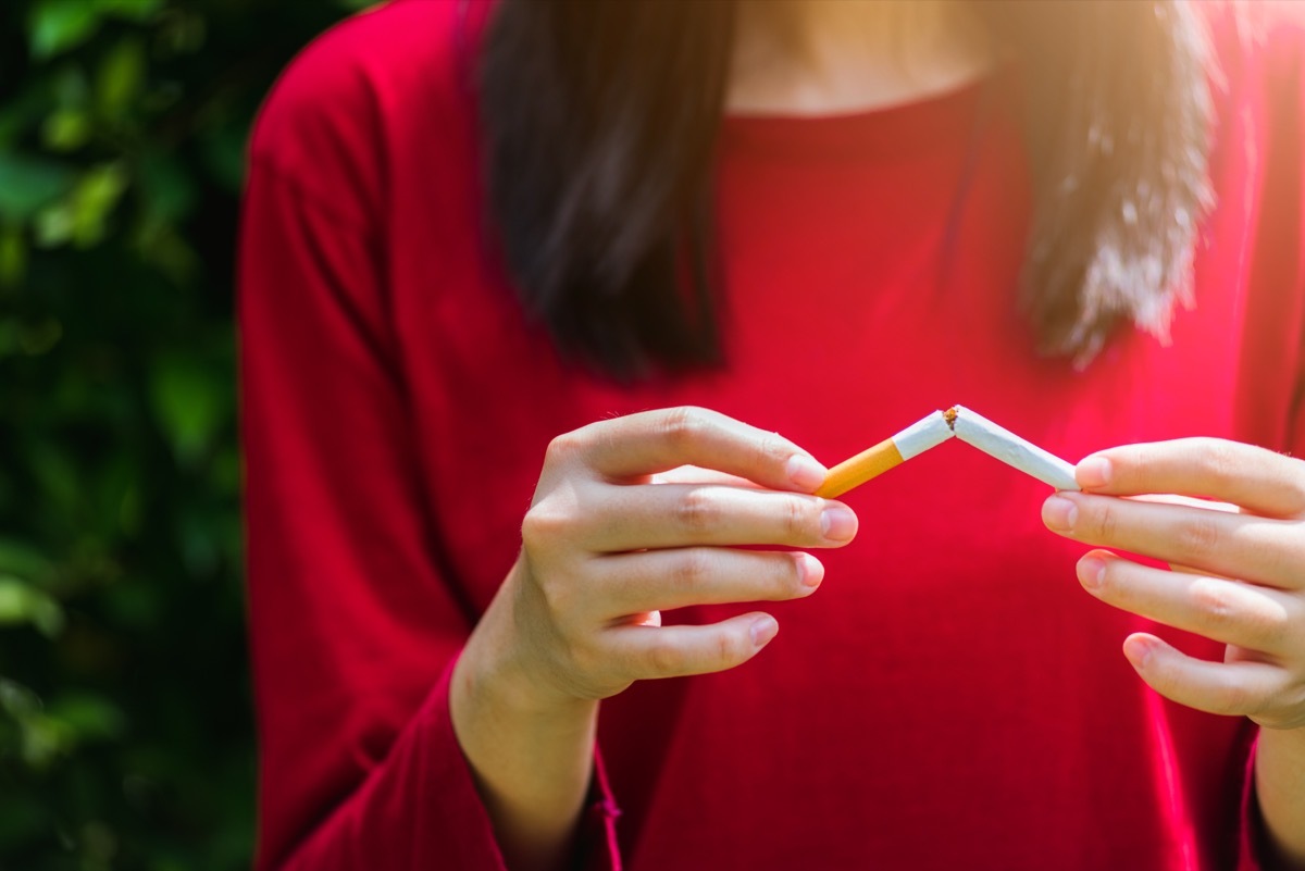 Woman Breaking a Cigarette