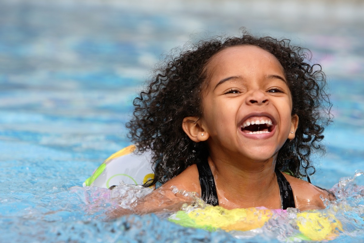 Child swimming in pool