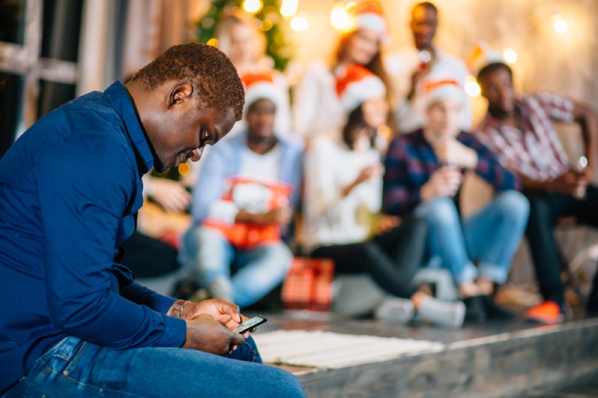 man alone at holiday party