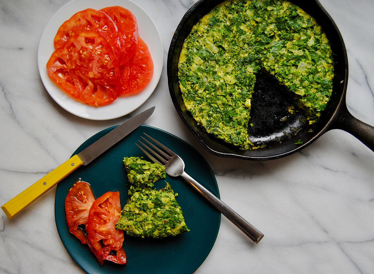 egg and herb frittata in skillet and on plate