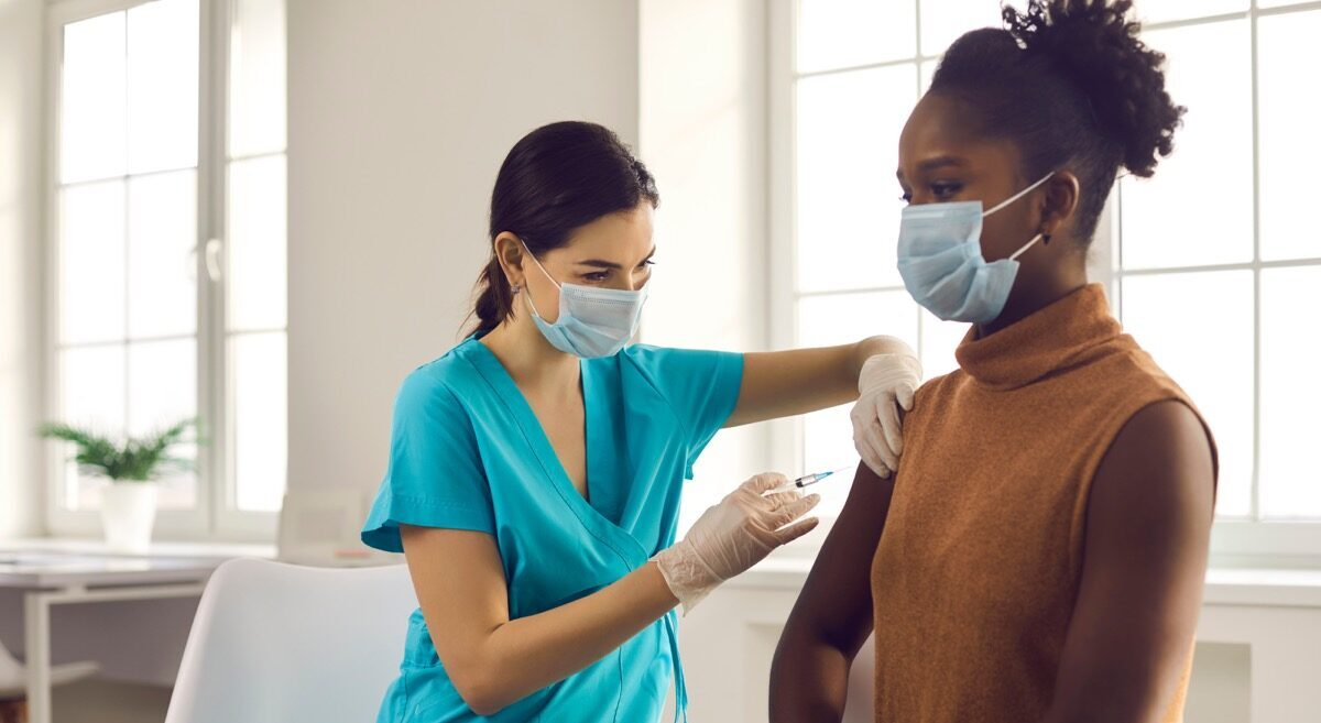 Woman getting COVID vaccine