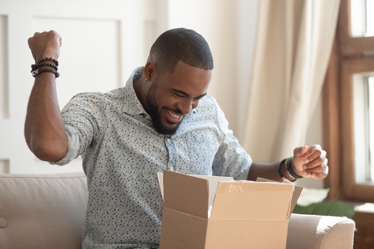 Man opening mail package