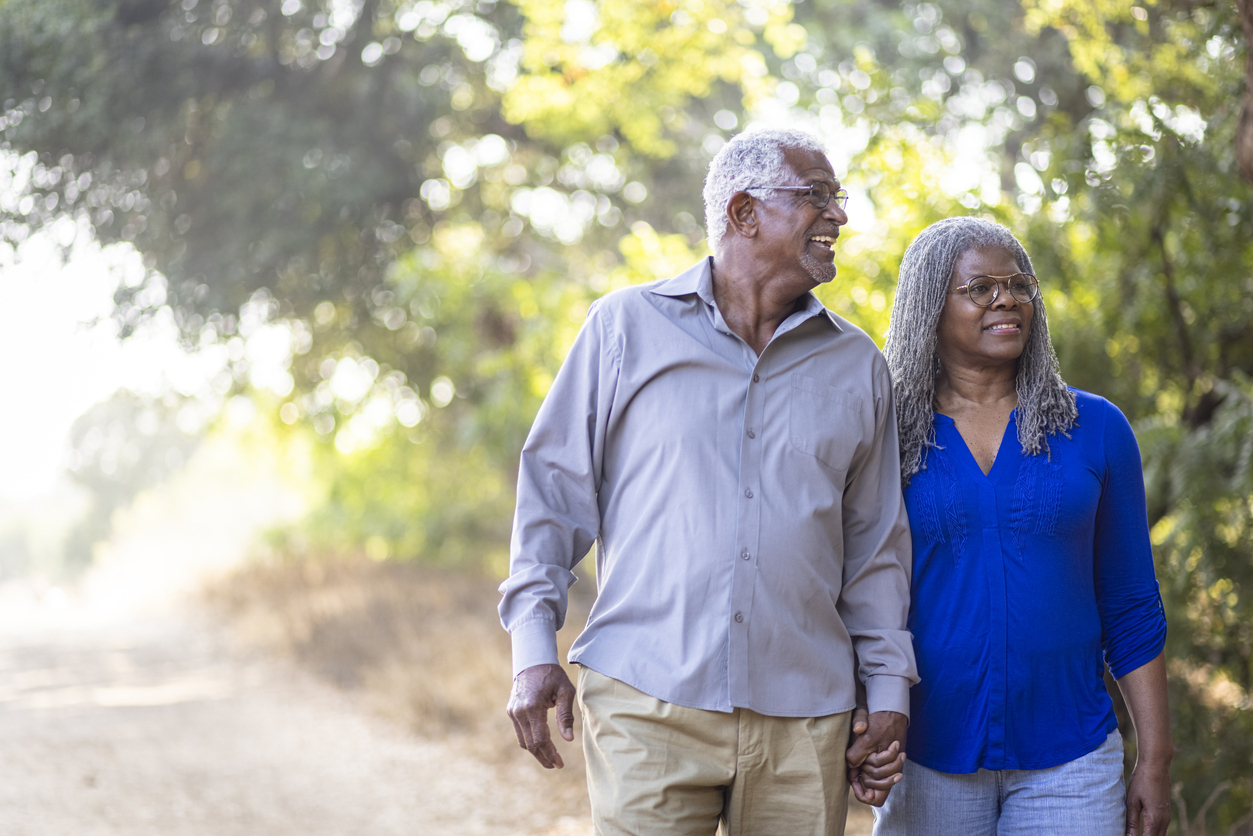 Senior couple taking a walk outside.