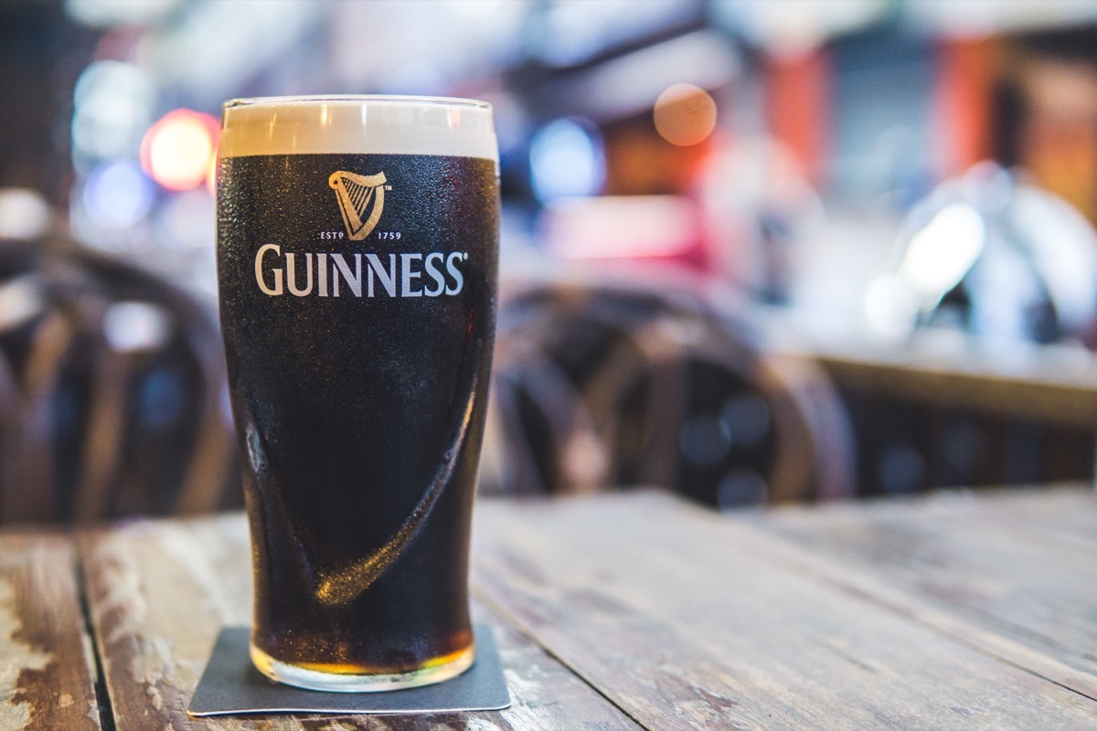 draft guinness beer in pint glass on table