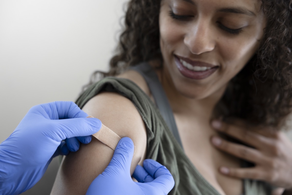 woman gets a vaccination.