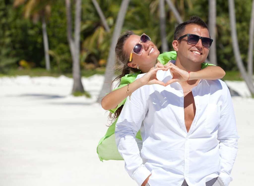 couple on beach smiling