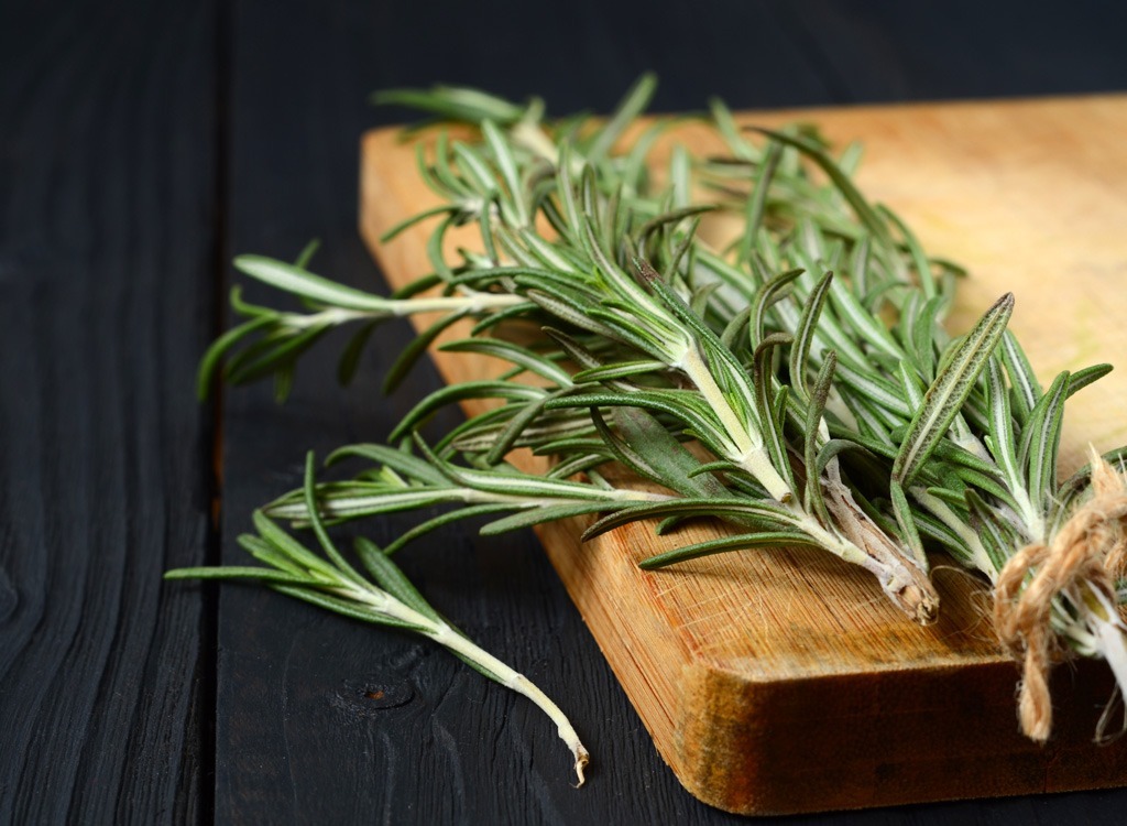 rosemary sprigs on cutting board