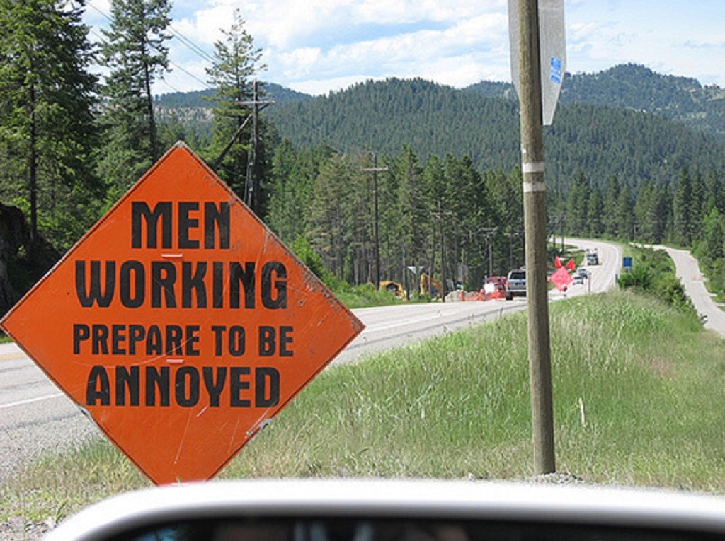 men working sign