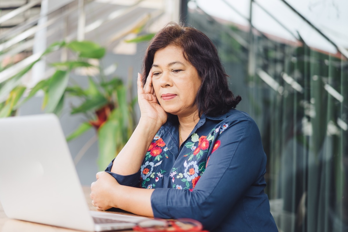 older asian woman working