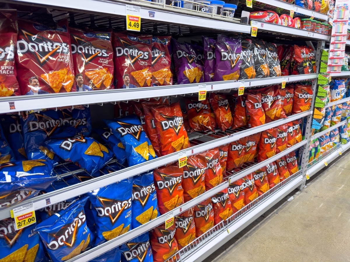 Los Angeles, California, United States - 02-01-2023: A view of several shelves dedicated to packages of Doritos chips, on display at a local grocery store.