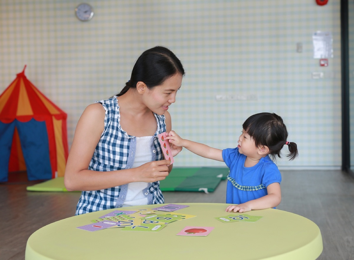 mom and daughter using flash cards, parenting myths