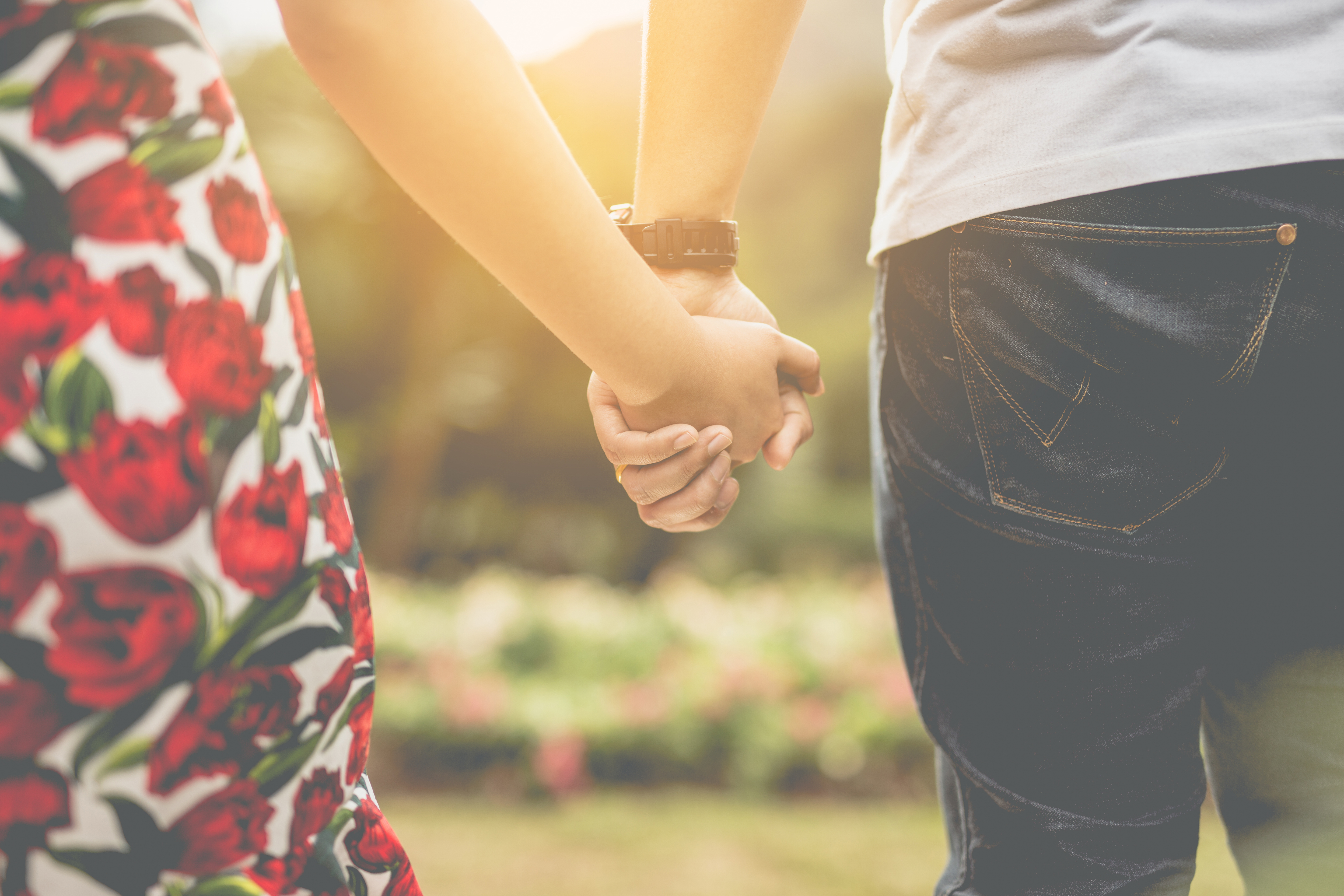 two people holding hands at sunset, what he wants you to say