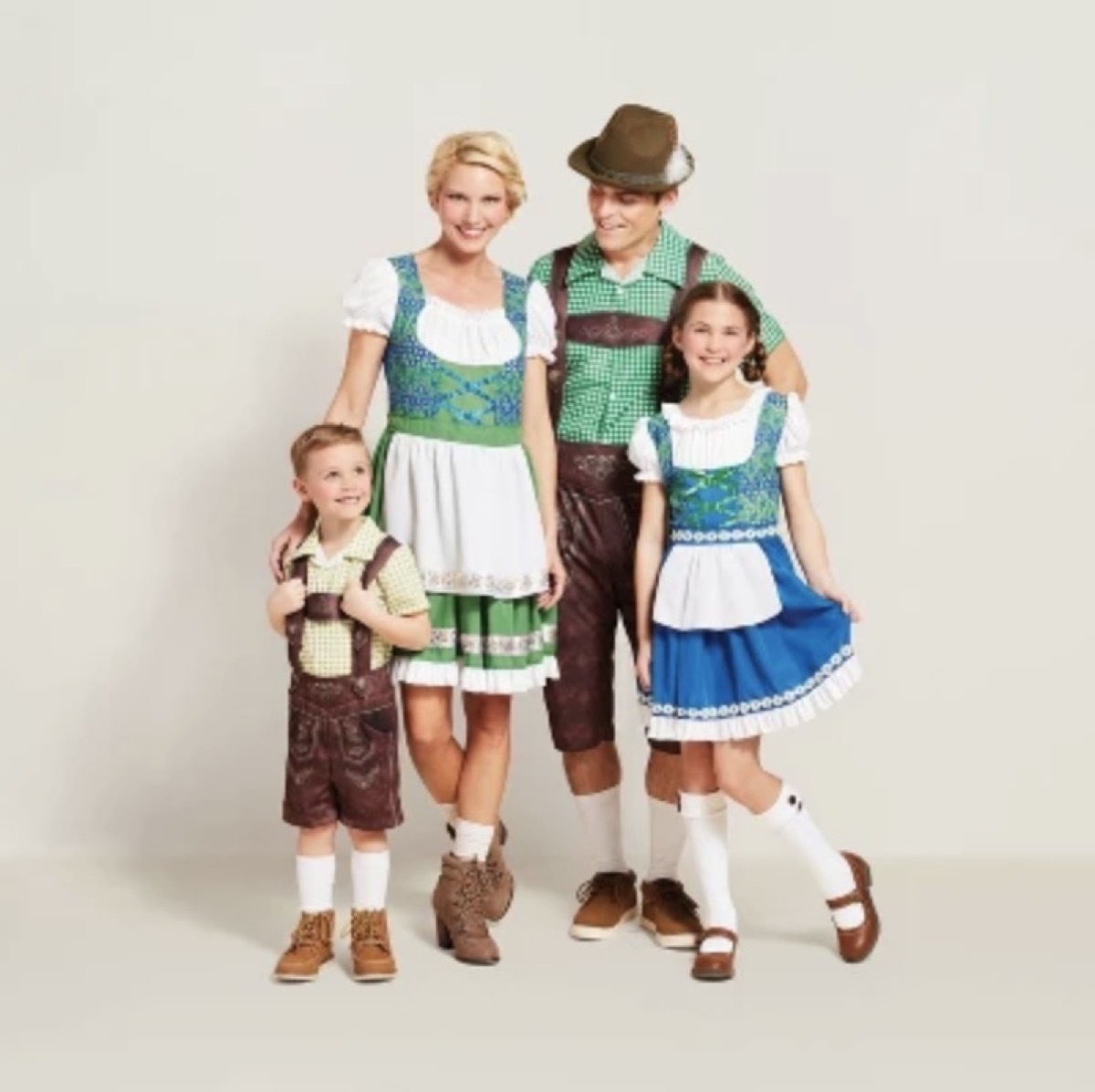 man, woman, and two children dressed in traditional german costumes, family halloween costumes