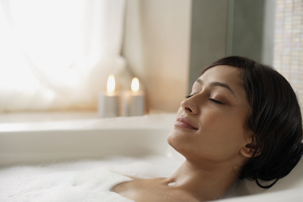 woman taking a relaxing hot bath