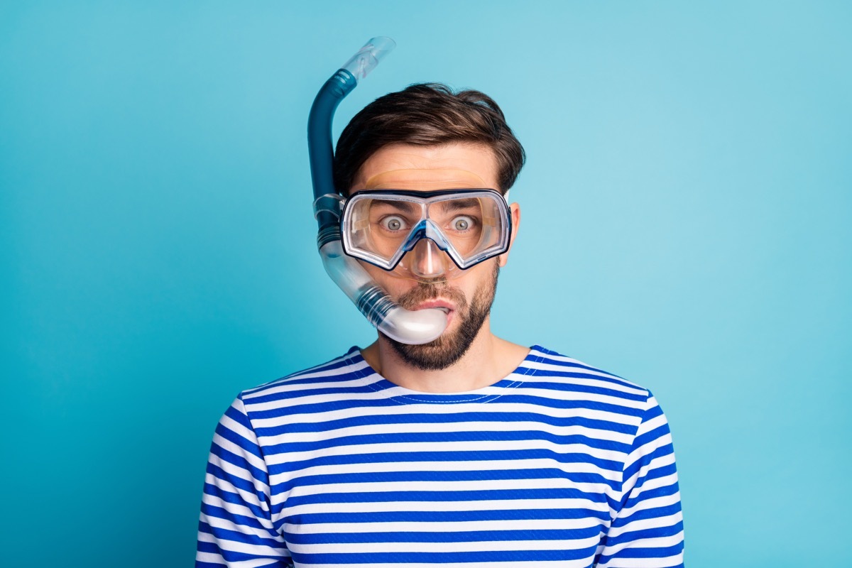 man wearing snorkeling mask