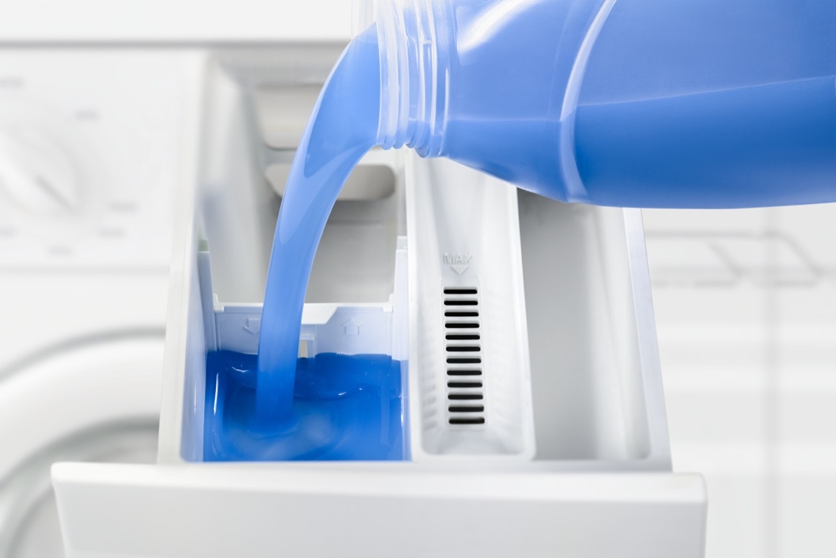 Filling detergent in the washing machine dispenser compartment - Image