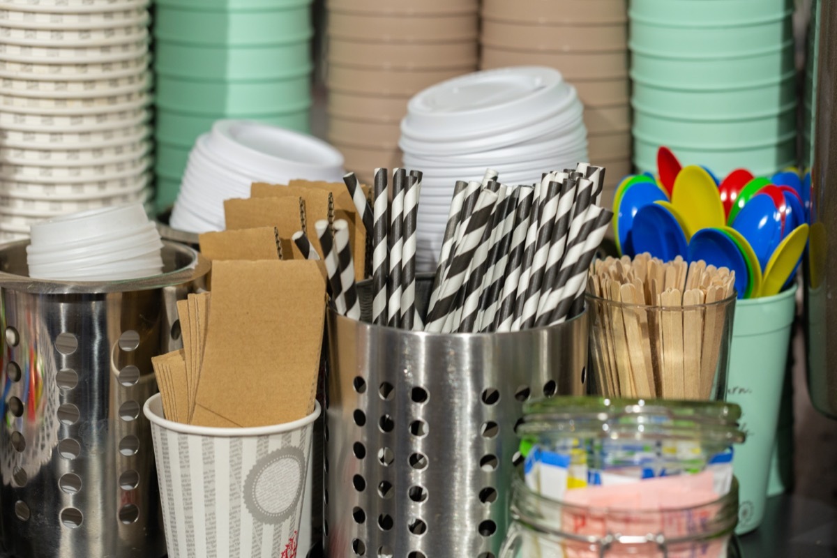 self serve coffee lids with straws at cafe