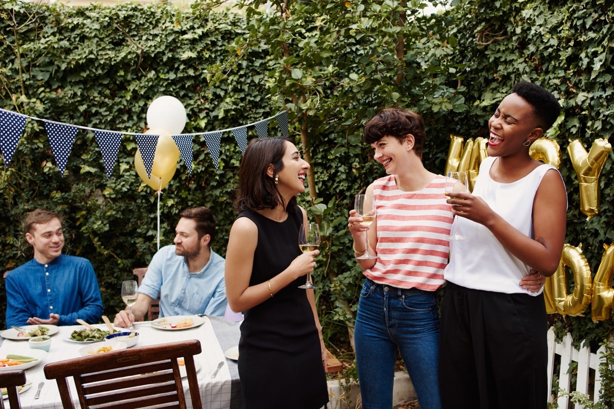 Cropped shot of a group of friends celebrating a birthday outdoors