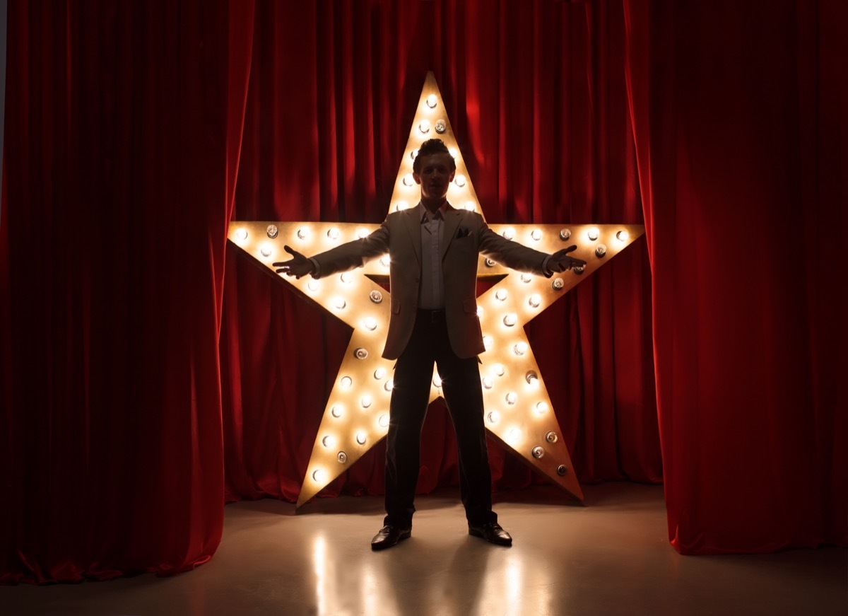 Man on Stage with LED Star