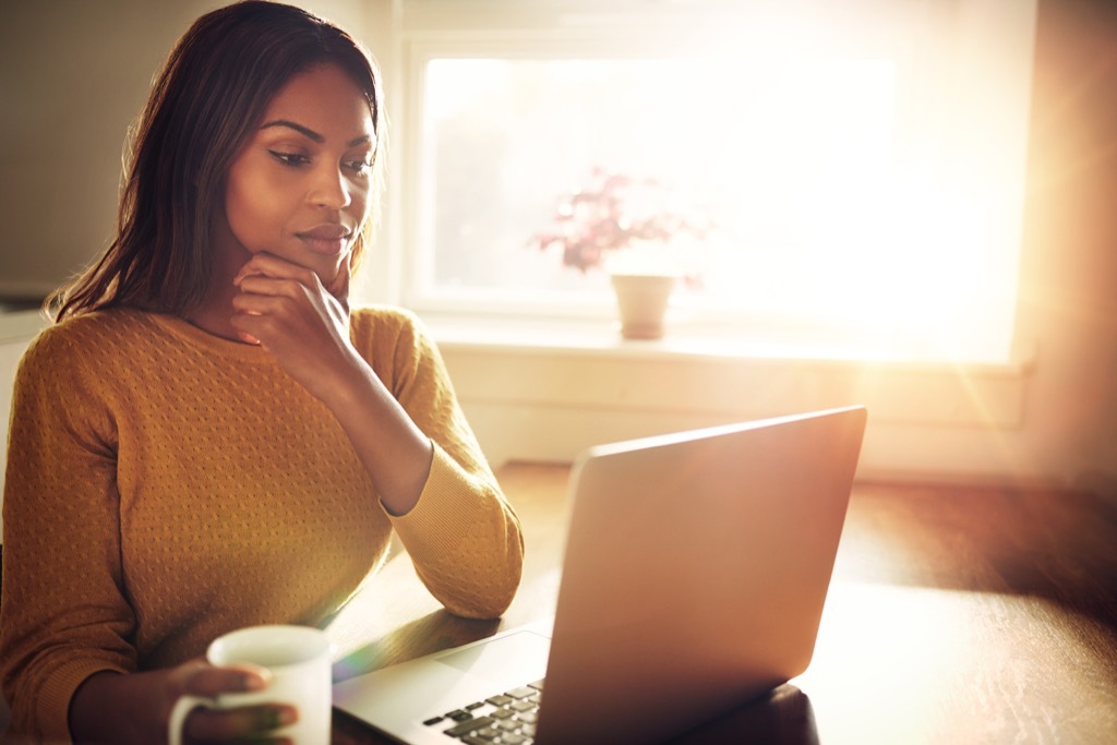 thoughtful woman on computer {Online Shopping Tips}