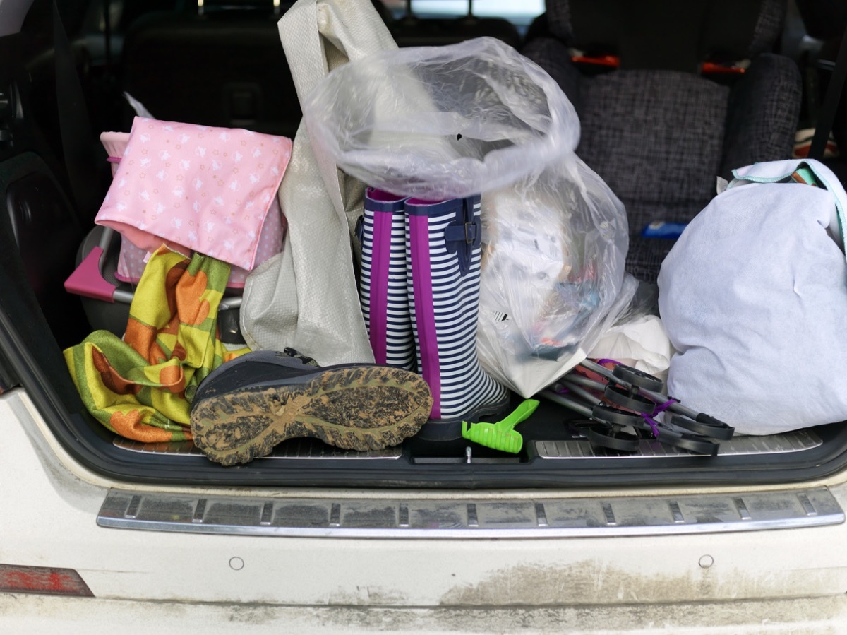 Personal effects stack in a car boot, outdoor close up