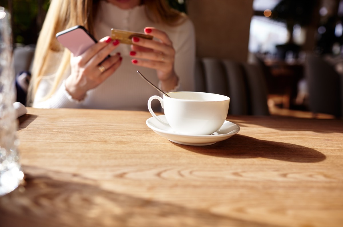 Woman in a cafe with a cup of coffee