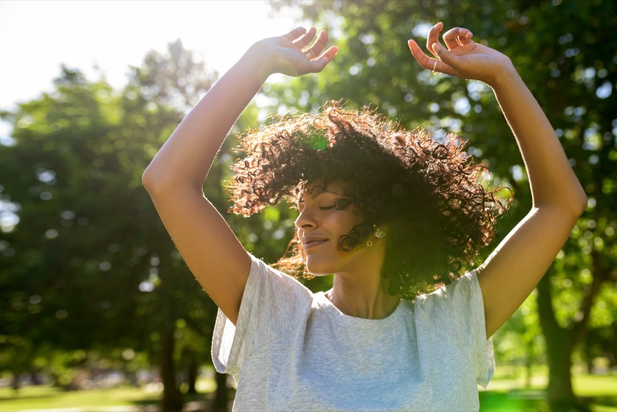 Woman dancing outside.