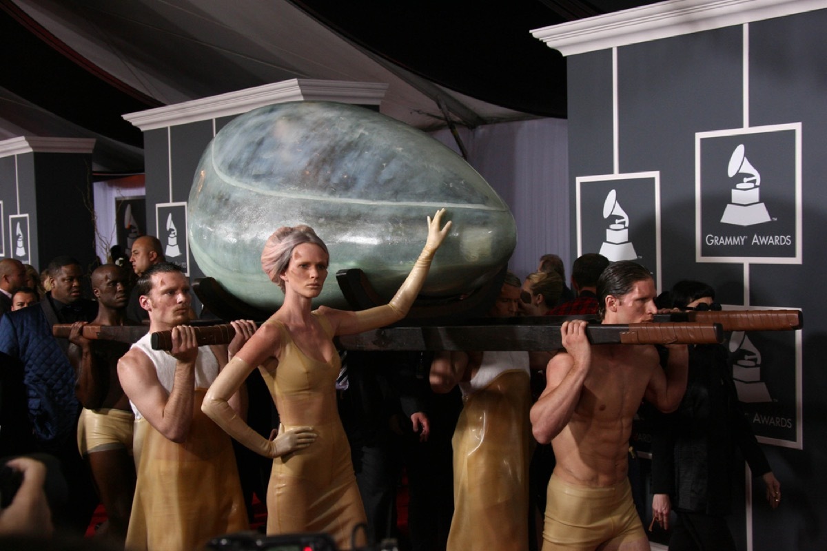 lady gaga inside an egg being carried into the grammy awards on the red carpet