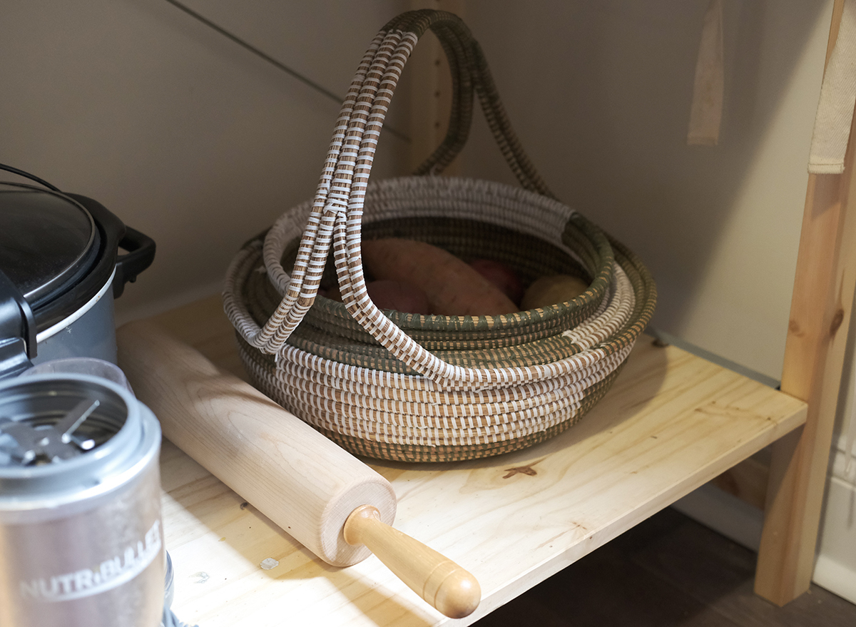 potatoes stored in a basket in a cool dark place