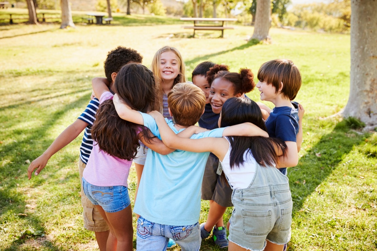 Kids in a huddle at recess playing contact sport